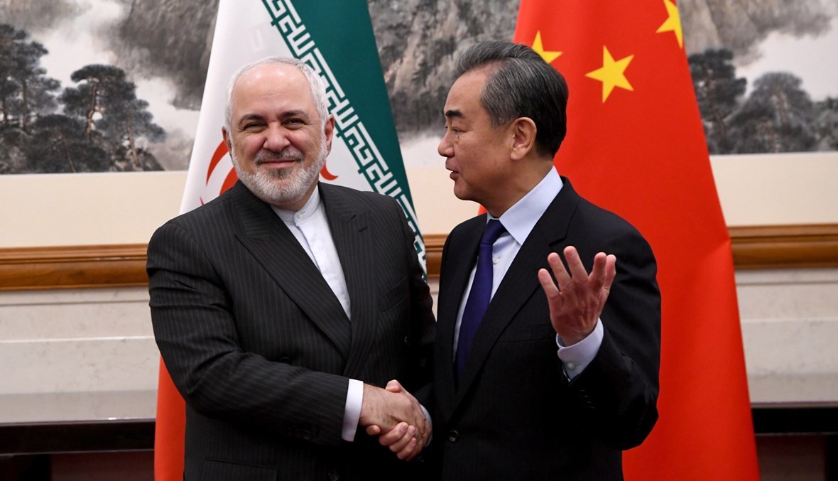 وزير الخارجية الصيني وانغ يي ووزير الخارجية الإيراني محمد جواد ظريف